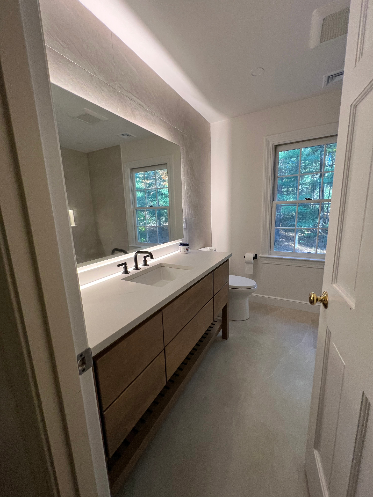 Modern spa style bathroom remodel by Cane Hill Wood Works in Weston MA.